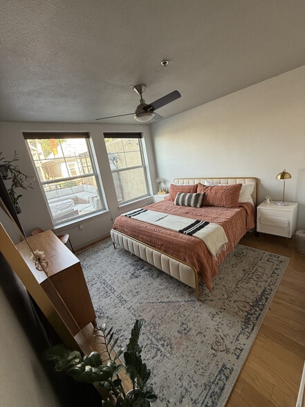 Primary Bedroom with king size bed and side tables - 1441 Central St