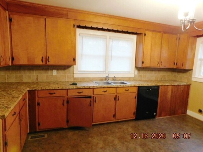 Building Photo - Home with 2 bedrooms, 1 bath, side deck, carport with side porch and detached garage