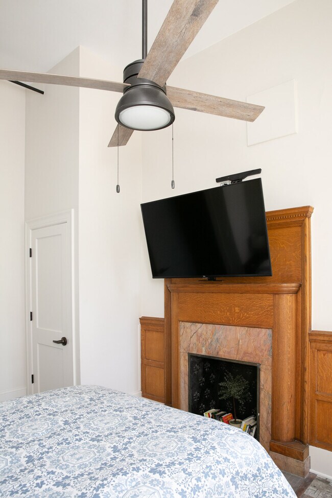 Tv & Fireplace view in bedroom - 121 E Water St