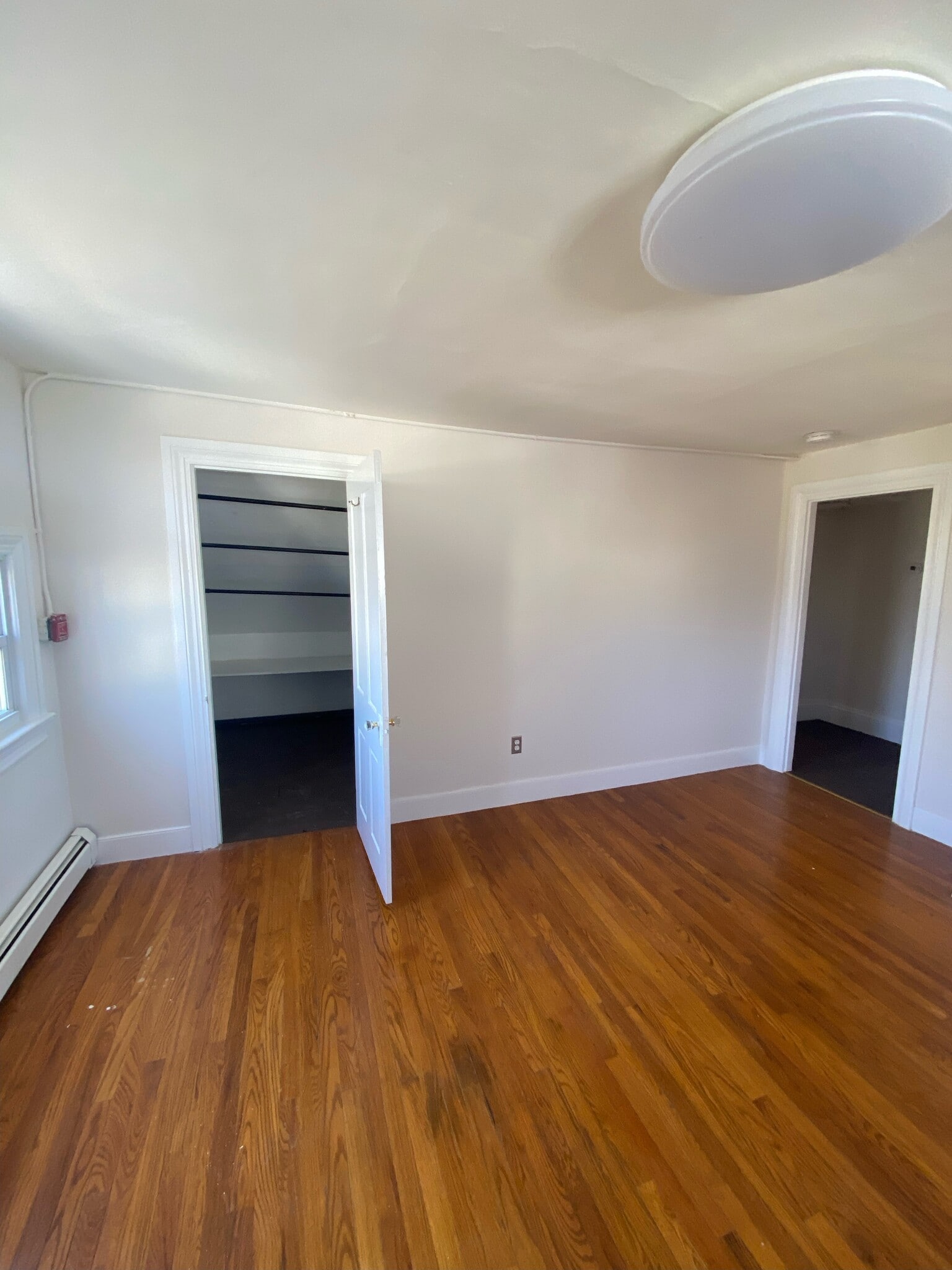 Living room, view into closet - 55 Grove St