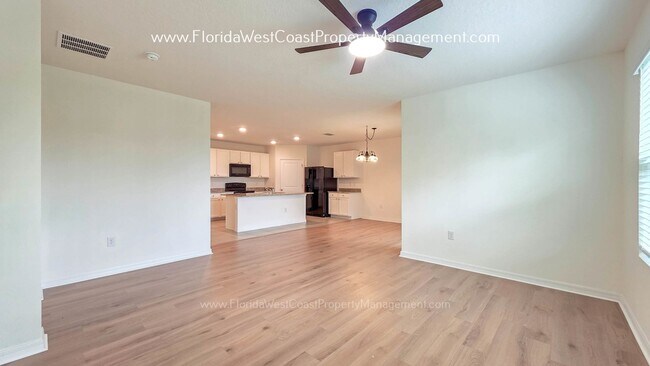 Building Photo - MOVE IN READY ! 4 BEDROOM/2 BATH! TILE- LVP THROUGHOUT! LAWN MOWING INCLUDED!