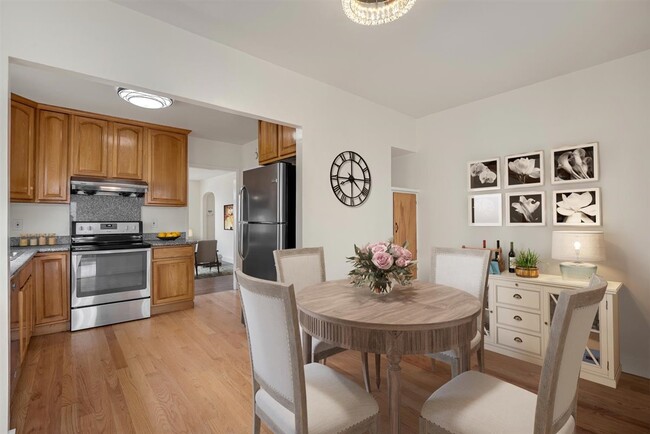 Adorable dining room allow for intimate dining above with a beautiful flush-mount mirror and crystal - 2108 E 23rd St