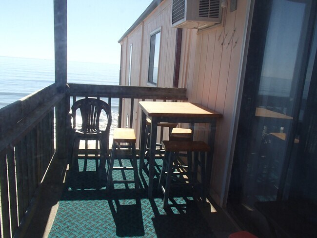 Building Photo - Ocean Front! Every day is a great day at the beach!!