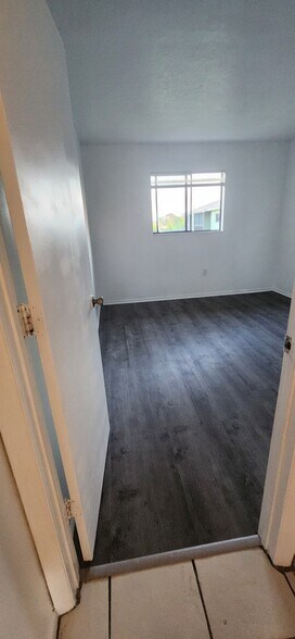 New vinyl floor in bedroom 1 - 1552 University Ln