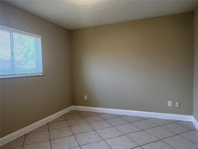 Building Photo - 6091 W 22nd Ct