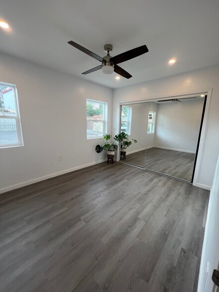 Large bedroom comfortably houses a full/queen size bed and furniture. - 9300 Benson Way