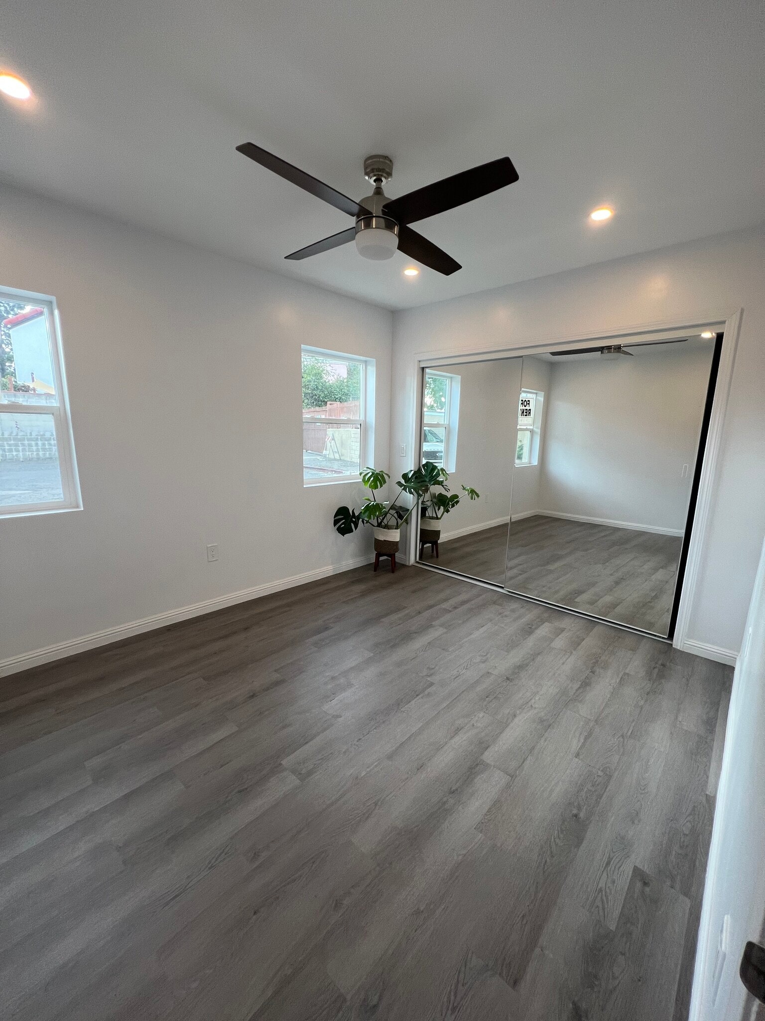 Large bedroom comfortably houses a full/queen size bed and furniture. - 9300 Benson Way