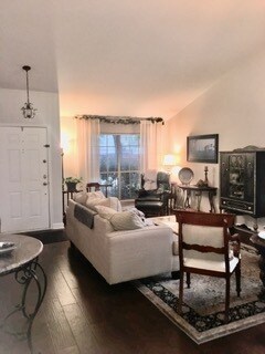 Front door and front of house living room, and large windows, and new wood floors. - 3809 Willie Mays Ln