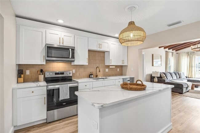 Building Photo - Coastal Luxury with Water Views – Fully Furnished, Utilities Included & Ready for Move-In!