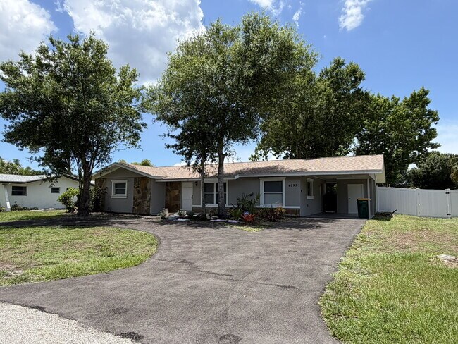 Building Photo - "Charming 3-Bedroom Home with Gleaming Hardwood Floors!"