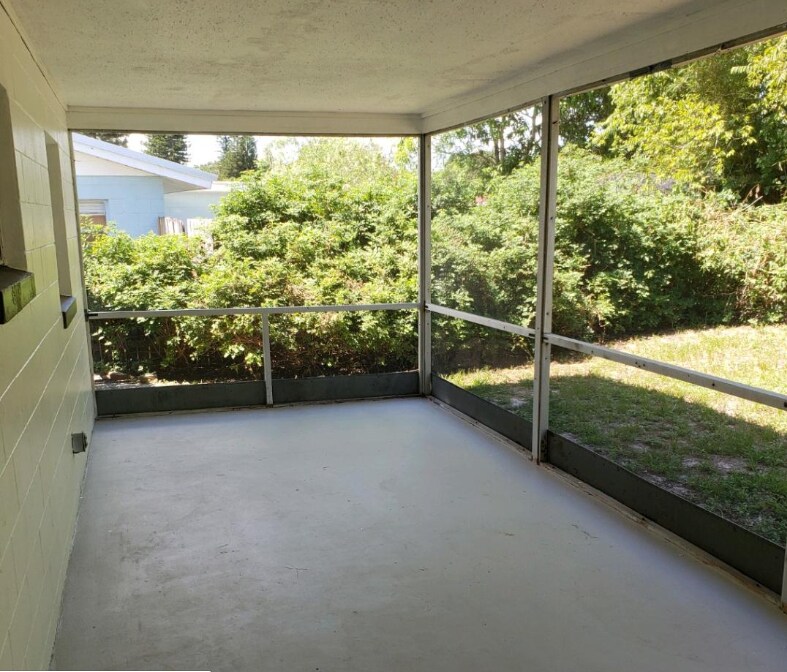 Screened in porch w/ seating and grill (not shown) - 745 Lunar Lake Cir