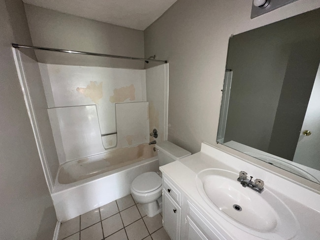 Building Photo - Charming 3BR/2BA Near Southwind | Soaring Vaulted Ceilings, Rustic Fireplace & Garage