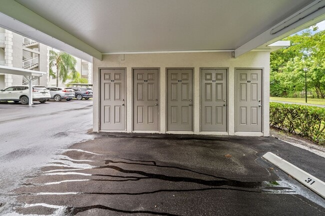 Building Photo - first-floor unit featuring a 2 bedroom, 2 bath fully furnished