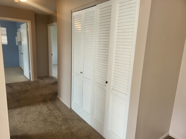Hallway to 3 bedrooms and main bath - 1777 Parkway Dr S