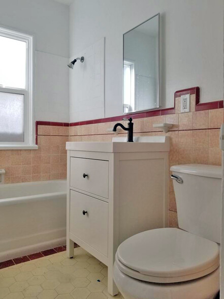 Updated bathroom with new vanity and toilet - 3505 12th Ave