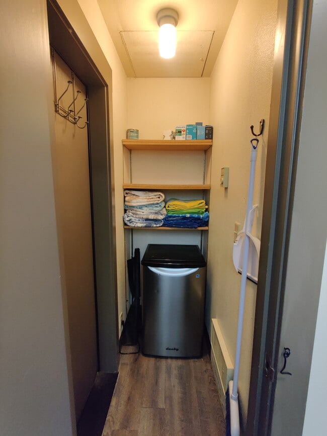 storage closet with mini fridge - 18575 SW Century Dr
