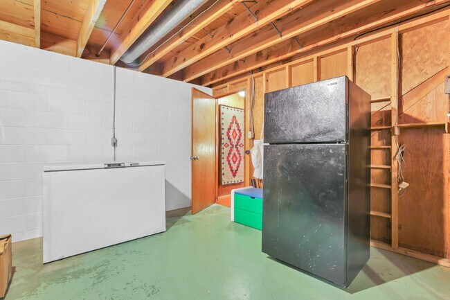 2 extra freezers and 1 extra fridge in basement - 162 Denison Dr