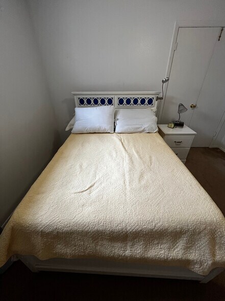 Bed and nightstand - 13632 Garden Grove Ct