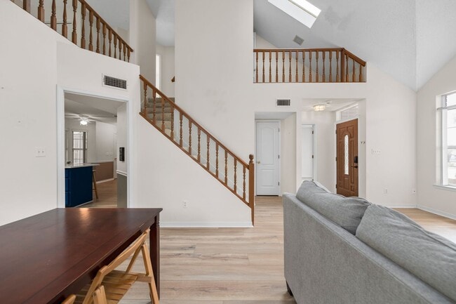 Building Photo - Spacious 3BR Retreat with Soaring Ceilings & Screened Porch