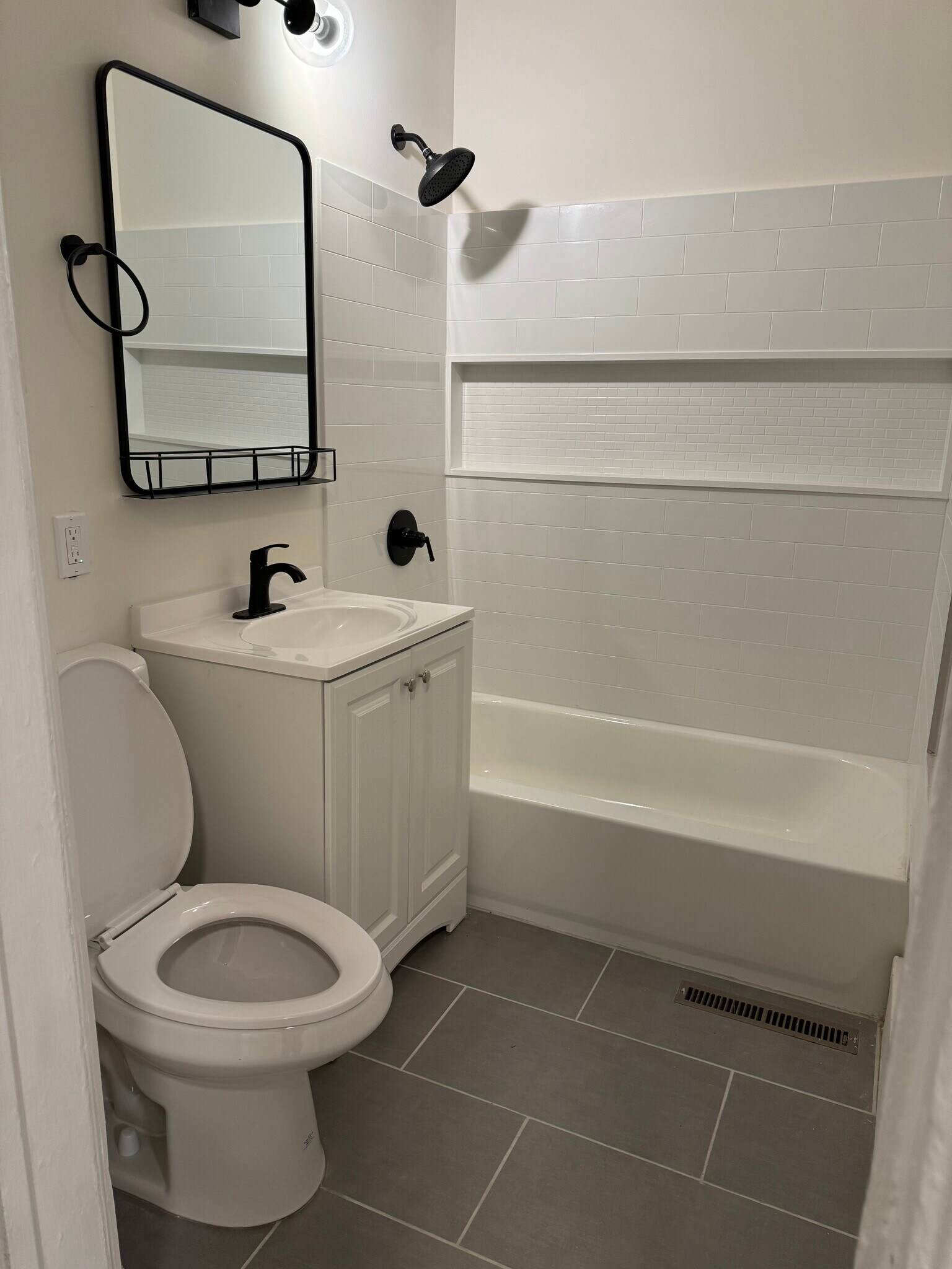 Renovated bath with new tile, shower and vanity - 118 Philip St