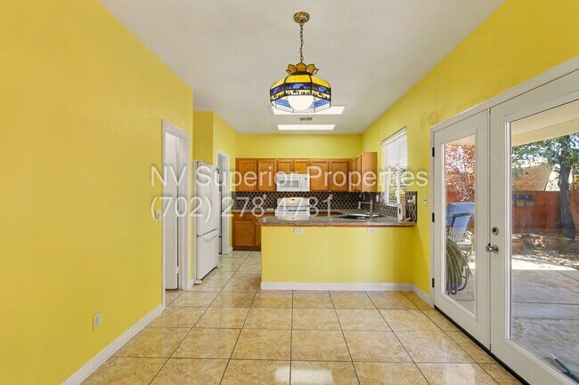 Building Photo - NW!! 4 Bedrooms!!! All Tile and Pergo flooring T/O!! NO Carpet!!! Low Maintenance Desert landscap...
