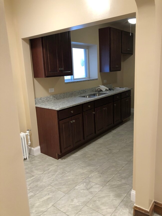 kitchen with granite countertop - 1648 N Nagle Ave