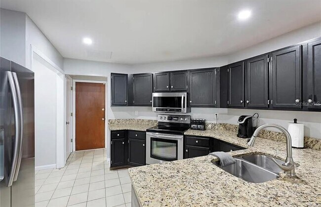 Building Photo - 7316 Caladesia Dr