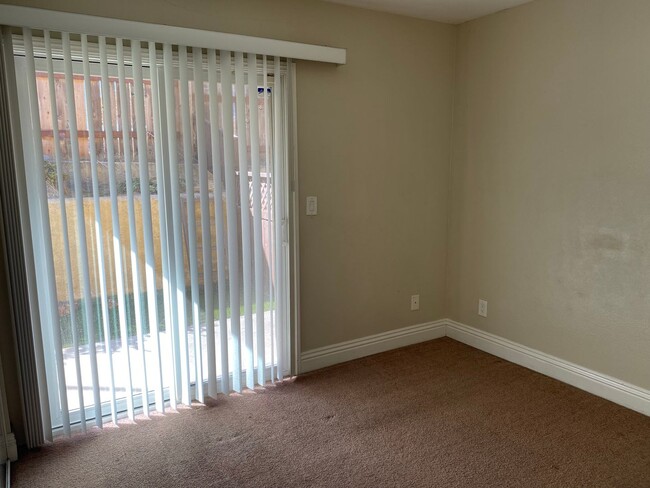 Building Photo - AFFORDABLE 1st Floor Condo & patio yard!