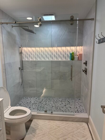 Newly remodeled guest shower with all new tile and lighting - 1031 1st St S