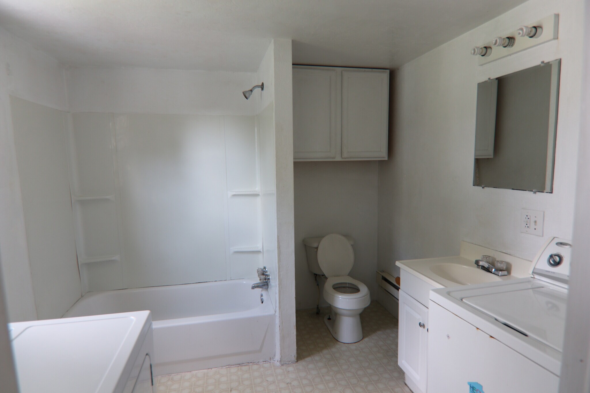 1st floor bathroom with laundry. - 348 Chittenden Ave