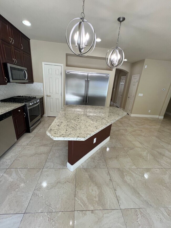 Building Photo - A Fantastic 4 Bedroom Home with the primary Downstairs, in Silverado Ranch