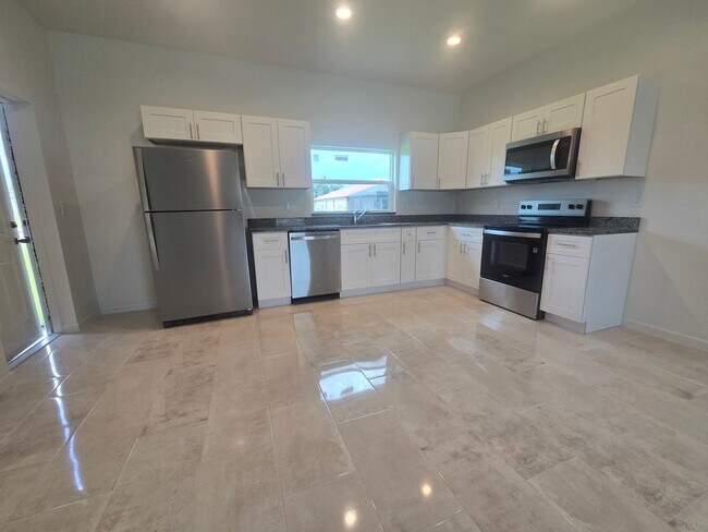 Building Photo - Brand New 3 BEDROOM 2 BATH AND ONE CAR GAR...