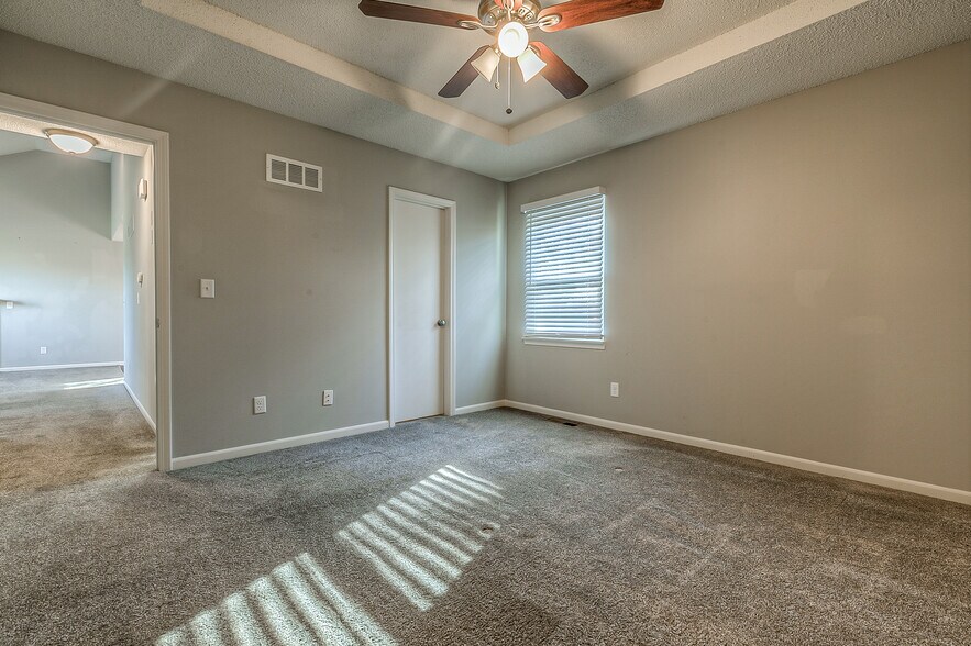 Master bedroom on 1st floor. Has ceiling fan and 2 closets with sliding doors. - 13749 W 62nd St