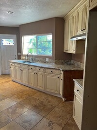 Building Photo - LARGE Lot - Nearly half acre.  Perfect for animals or gardening.  Updated interior, New Gas Range...