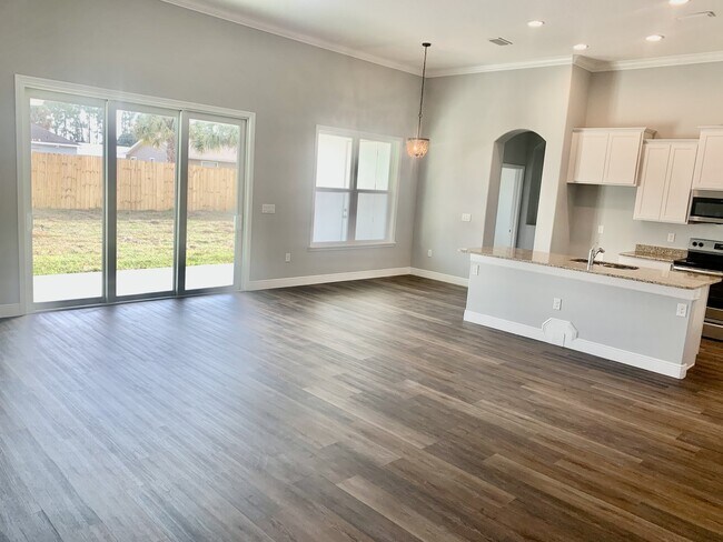 Building Photo - "Spacious 4-Bedroom 3-Bath with In-Law Suite & Granite Finishes in Palm Bay!"