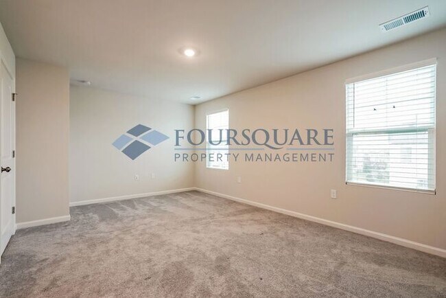 Building Photo - Three Story Town Home | Entry Level Bedroo...