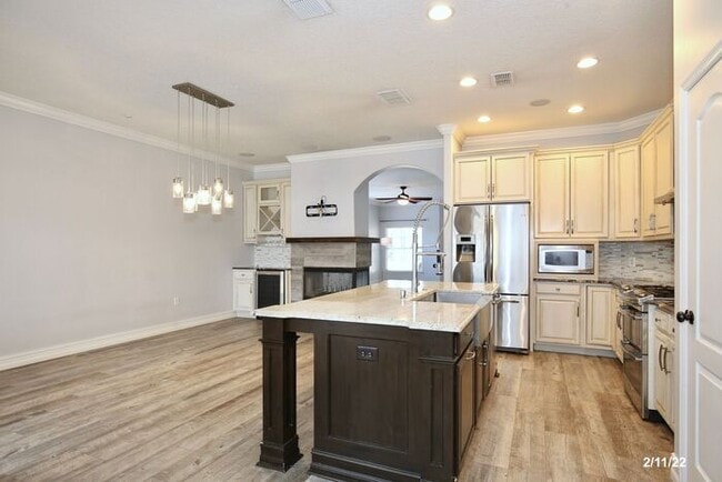 Building Photo - Luxurious 4/3 Waterfront Home with an In-ground Spa, an In-law Suite and a 2 Car Garage in the Hi...