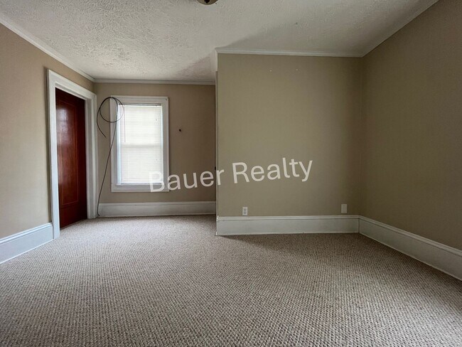Building Photo - Three bedrooms, one and a half baths