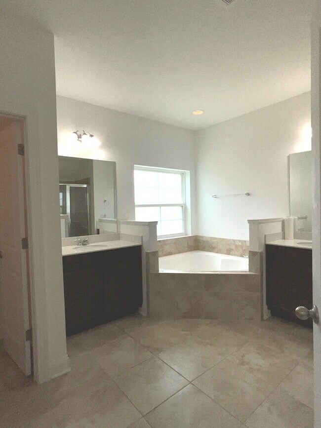 Building Photo - "Spacious 4-Bed Oasis with Stunning Lake V...