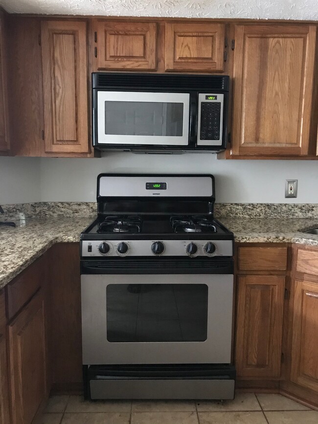 Contemporary kitchen with stainless steel appliances and new dishwasher. - 107 Swanton Hill Ct