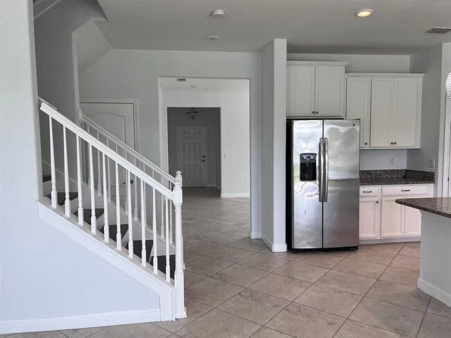 Building Photo - "Spacious 5-Bed Retreat with Elegant Hardwood & Granite Finishes in Tampa – 3 Full Baths & 3264 S...