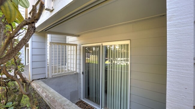 Building Photo - This ground floor corner-unit condo