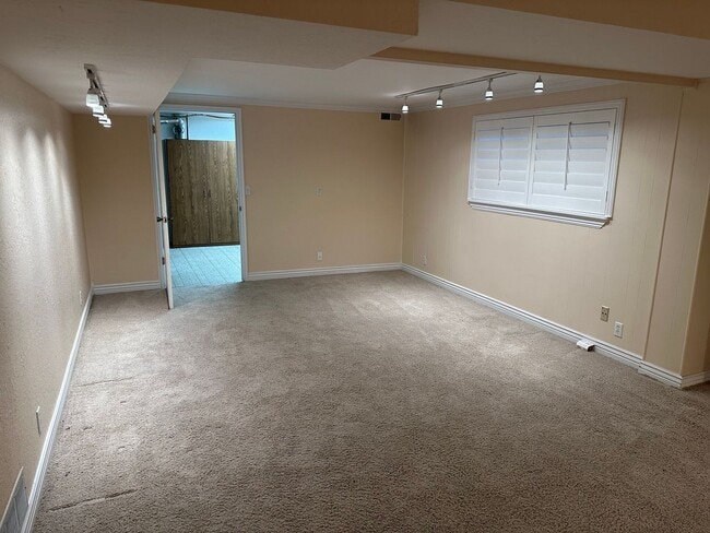 Building Photo - Spacious Millcreek Townhome with Two Living Areas, Private Deck & Community Amenities