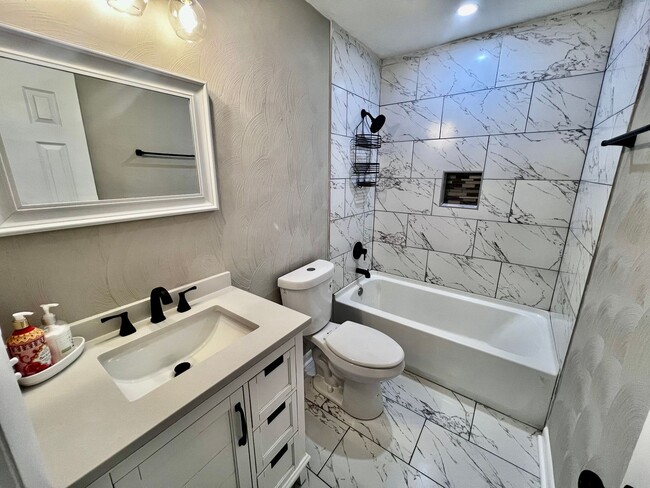 Building Photo - Come see this FULLY renovated two-story tr...