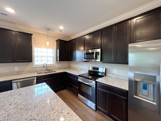 Building Photo - Beautiful Like-New 3 bed/2.5 bath w/ 2-car garage & fenced in backyard available June 24th!