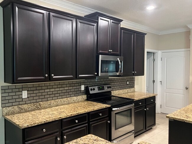 Building Photo - Spacious 5-Bedroom Home with Lawn Care Included!