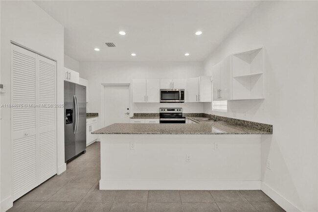 Building Photo - 6323 NW 1st Pl