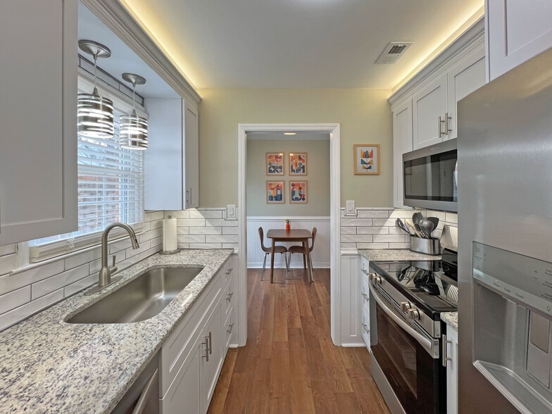 Well lit kitchen w/complete suite of appliances, luxurious granite counter tops, Keurig coffee stati - 160 17th Street Pl NW