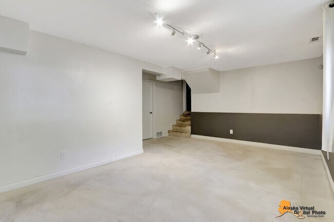 Building Photo - Eagle River Home w/ Fenced Yard, Sunroom, and Garage!