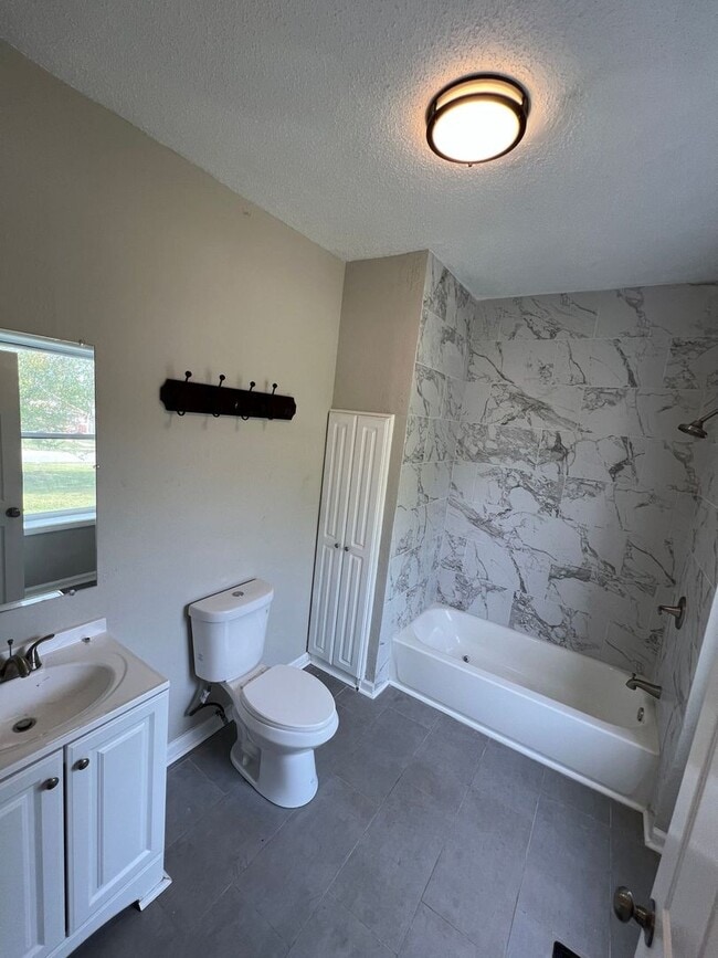 Building Photo - Coming soon! Updated 4-Bedroom Home with Plenty of Living and Storage Space.